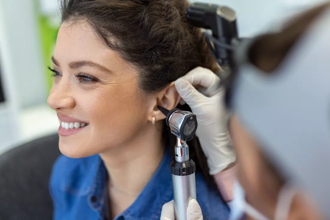 close-up-female-doctor-carefully-holding-ear-his-patient-establish-clearer-view-inside-his-ear-see-if-he-requires-hearing-aids-modern-clinic