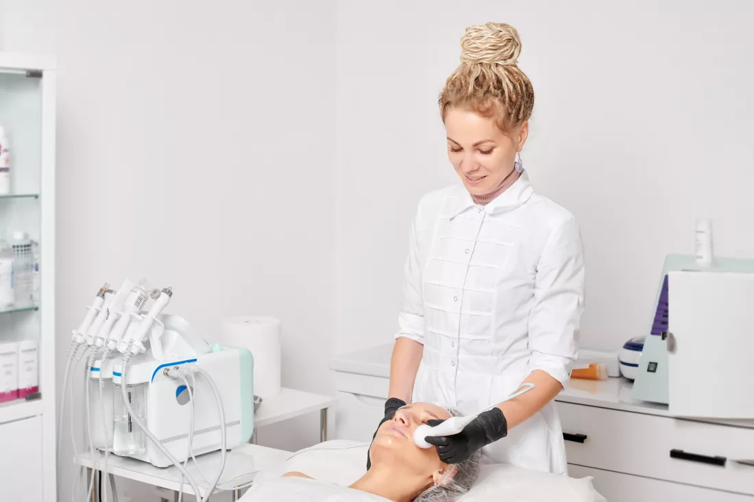 portrait-young-woman-using-mobile-phone-while-sitting-home