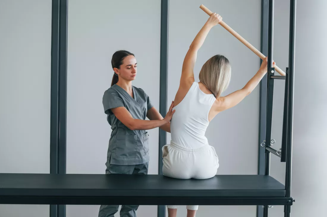 spine-exercises-woman-is-health-center-getting-help-by-doctor