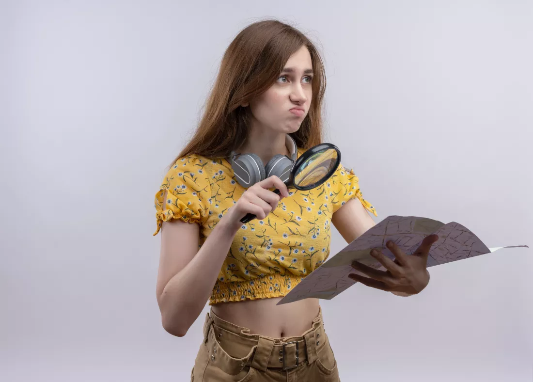 young-girl-holding-magnifier-glass-map-isolated-white-wall-with-copy-space