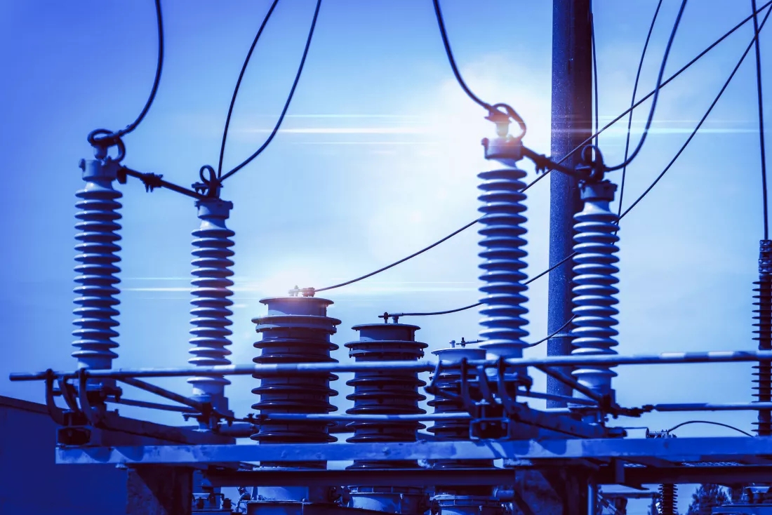 high-voltage-power-transformer-substationhigh-voltage-electric-power-transformers-blue-cloudy-skytoned