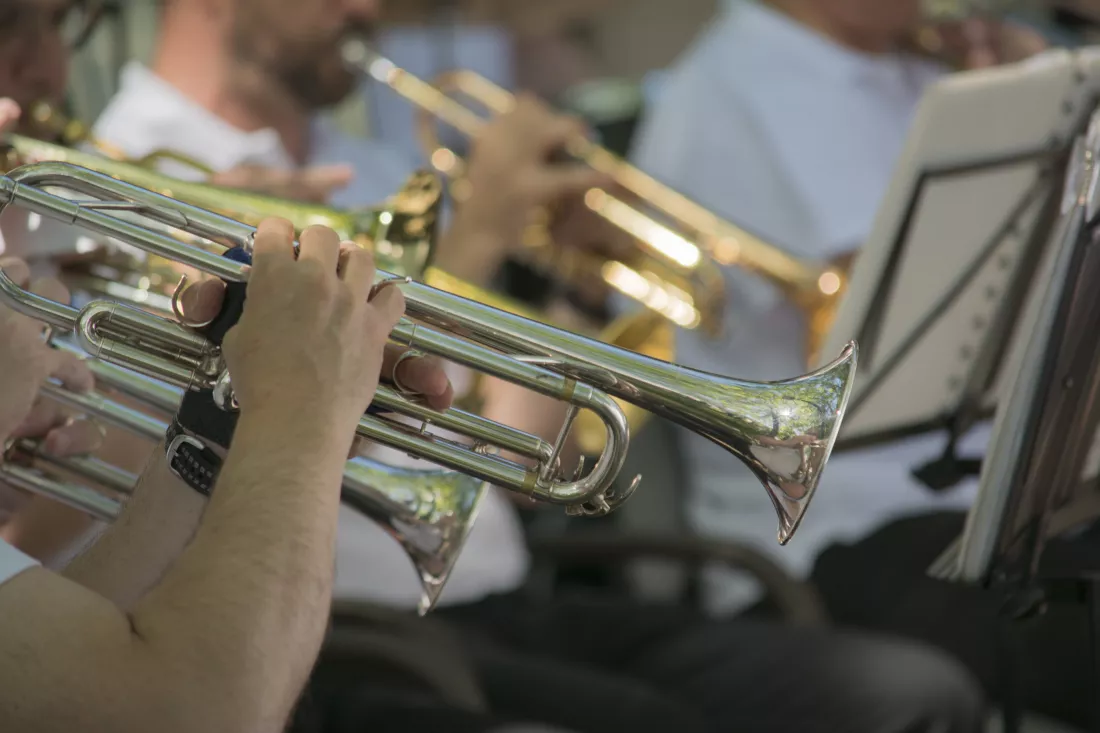 midsection-people-playing-trumpet