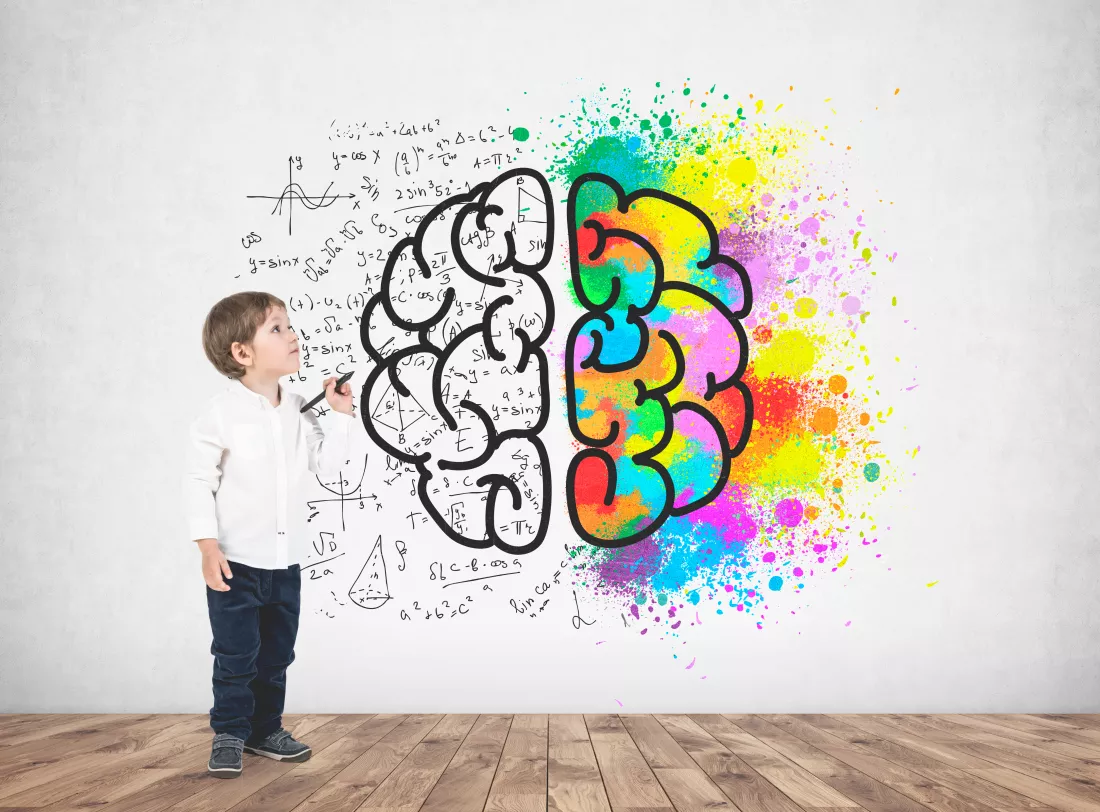 cute-little-boy-white-shirt-dark-jeans-holding-marker-looking-upwards-concrete-wall-with-colorful-brain-sketch-it