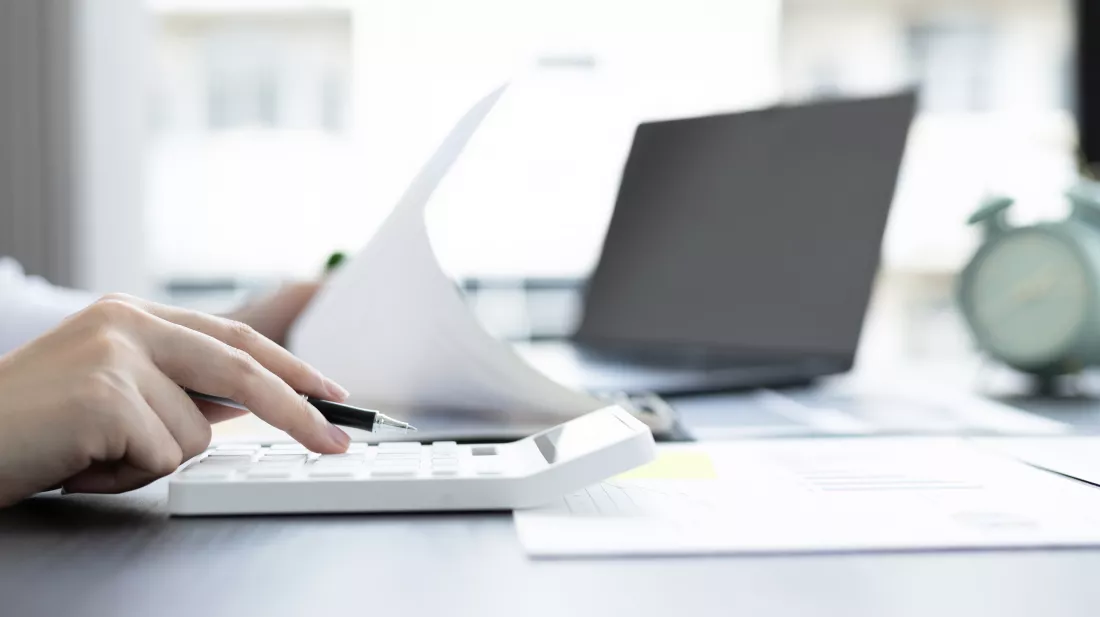 young-asian-businesswoman-presses-calculator-calculate-income-tax-corporate-income