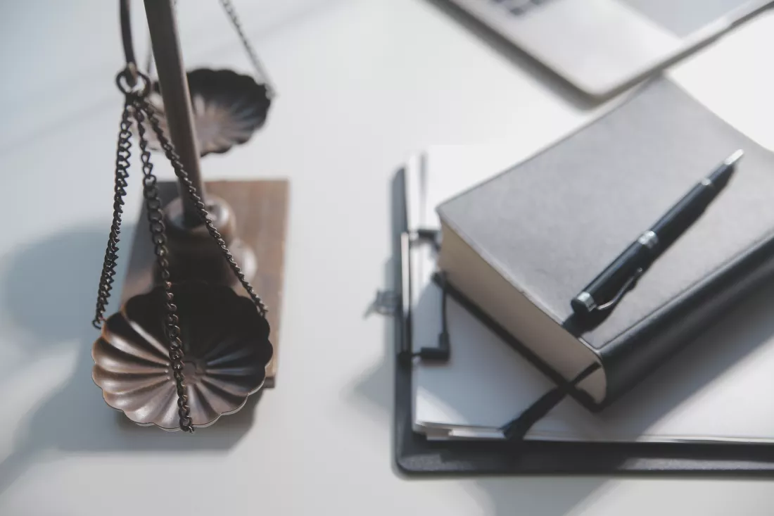 business-lawyers-discussing-contract-papers-with-brass-scale-desk-office-law-legal-services-advice-justice-law-concept-picture-with-film-grain-effect(3)