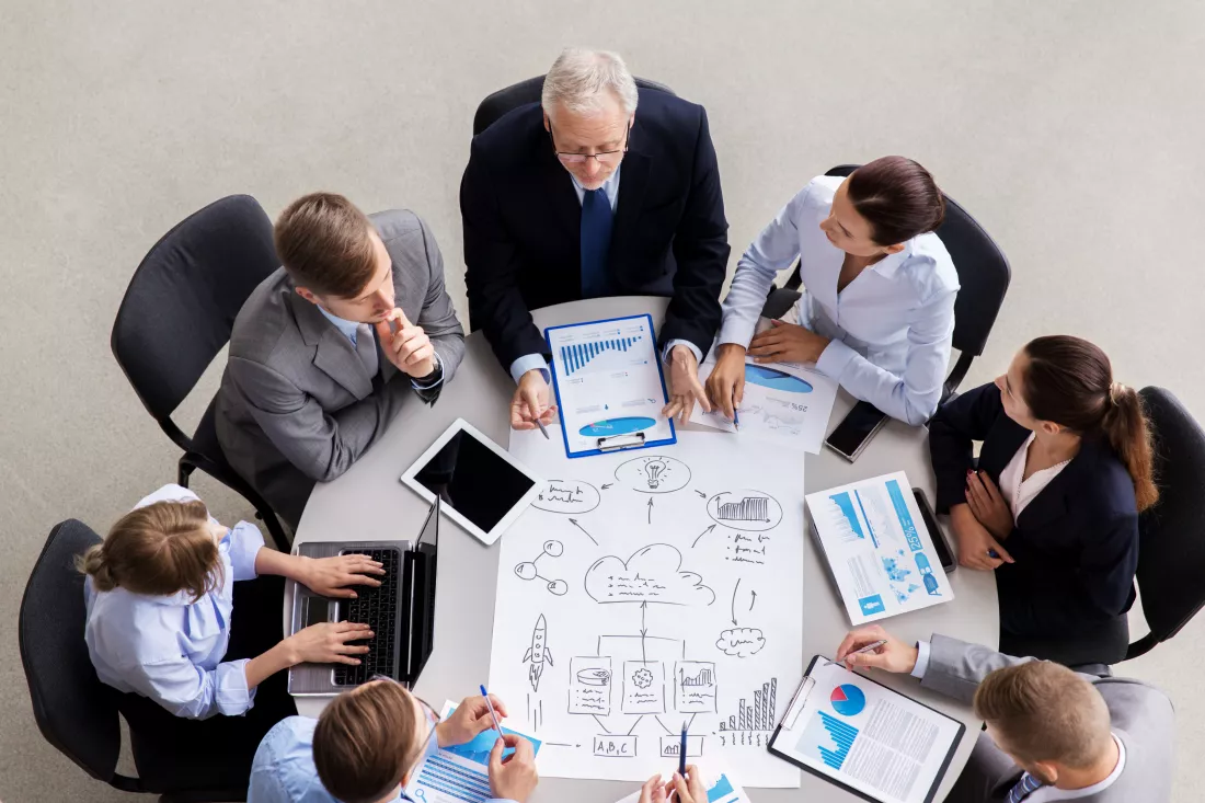 business-team-with-scheme-meeting-office