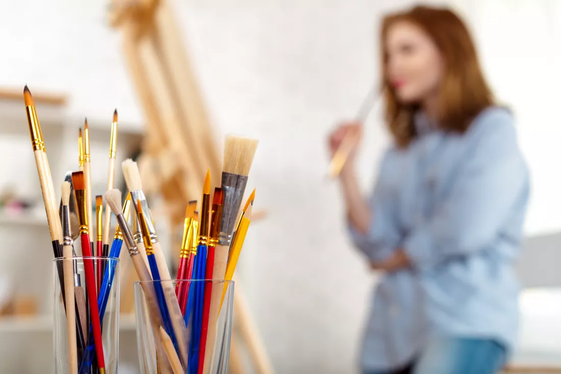 painting-supplies-brushes-easel-workplace-artist