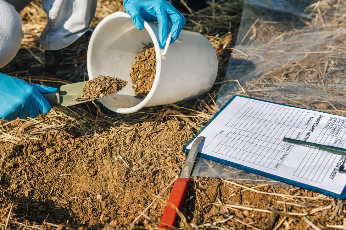 soil-testing-agronomy-inspector-taking-soil-sample