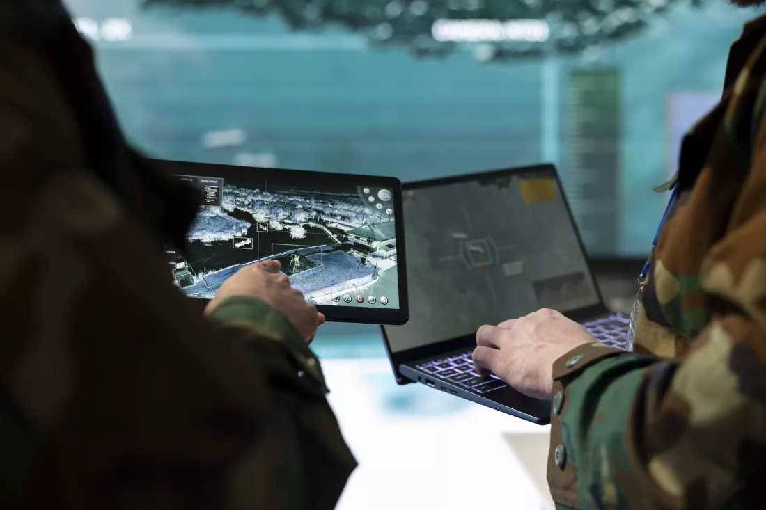 troopers-comparing-gathered-radar-information-laptop-tablet